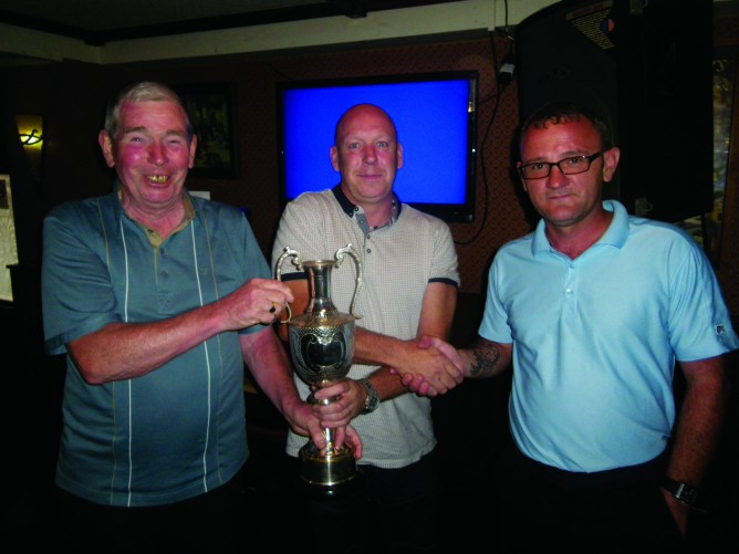 Eddie McAteer President and the Captain Joe Craig right presents the Dan Rooney Cup to Chris McCrory 668x501 Dan Rooney Cup 2014